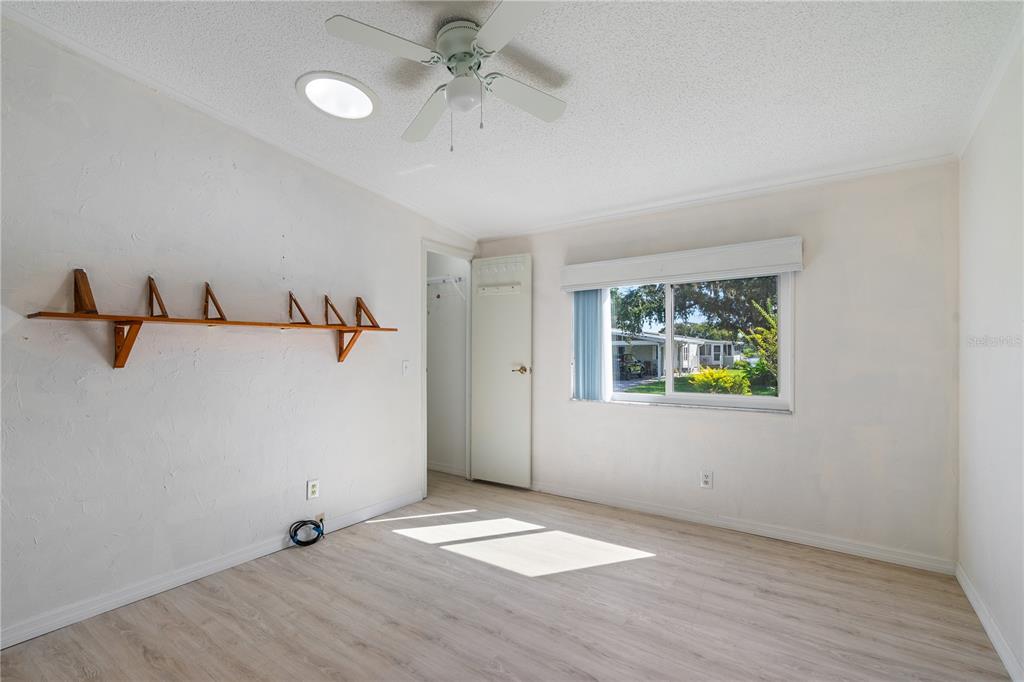701 Helmsman Lane Edgewater, FL 32141 - Photo 28 of 73 wooden floor in an empty room with a window