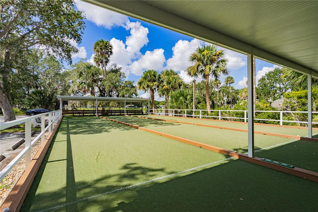 701 Helmsman Lane Edgewater, FL 32141 - Photo 51 of 73 a view of a swimming pool with a garden