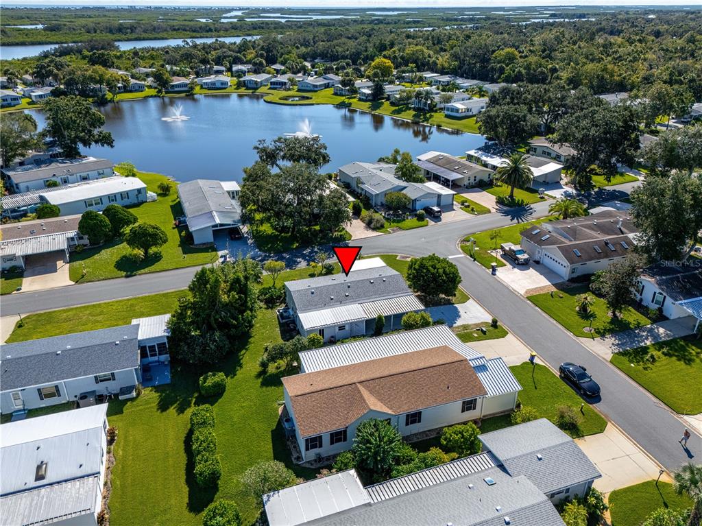 701 Helmsman Lane Edgewater, FL 32141 - Photo 54 of 73 an aerial view of a houses and lake view