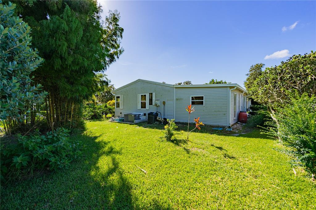 701 Helmsman Lane Edgewater, FL 32141 - Photo 70 of 73 a view of backyard of house with green space