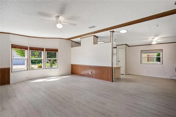 a kitchen with white cabinets and a sink