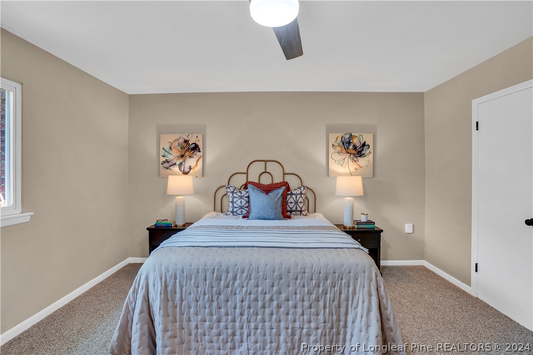 2540 Graham Road Fayetteville, NC 28304 - Photo 13 of 22 a bedroom with a bed and a painting on the wall