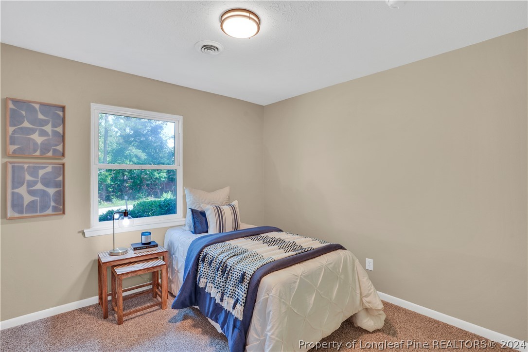 2540 Graham Road Fayetteville, NC 28304 - Photo 16 of 22 a bedroom with a bed and a window