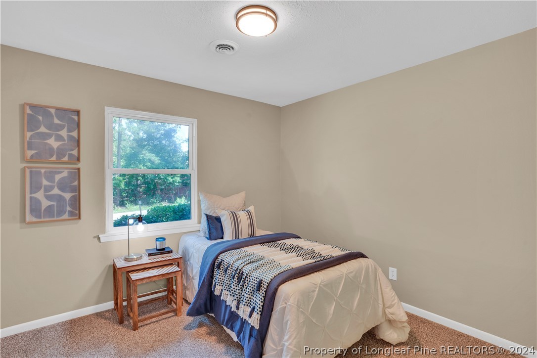 2540 Graham Road Fayetteville, NC 28304 - Photo 17 of 22 a bedroom with a bed and a window