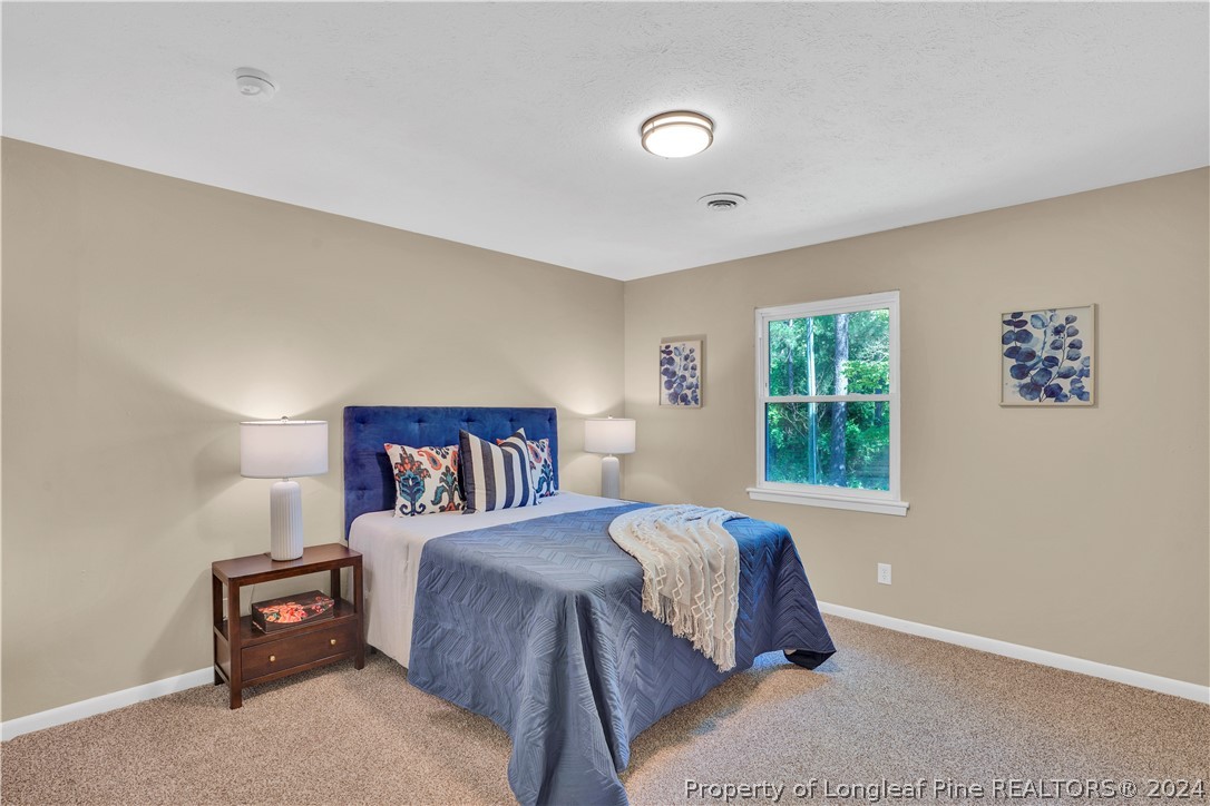 2540 Graham Road Fayetteville, NC 28304 - Photo 18 of 22 a bedroom with a bed and a window