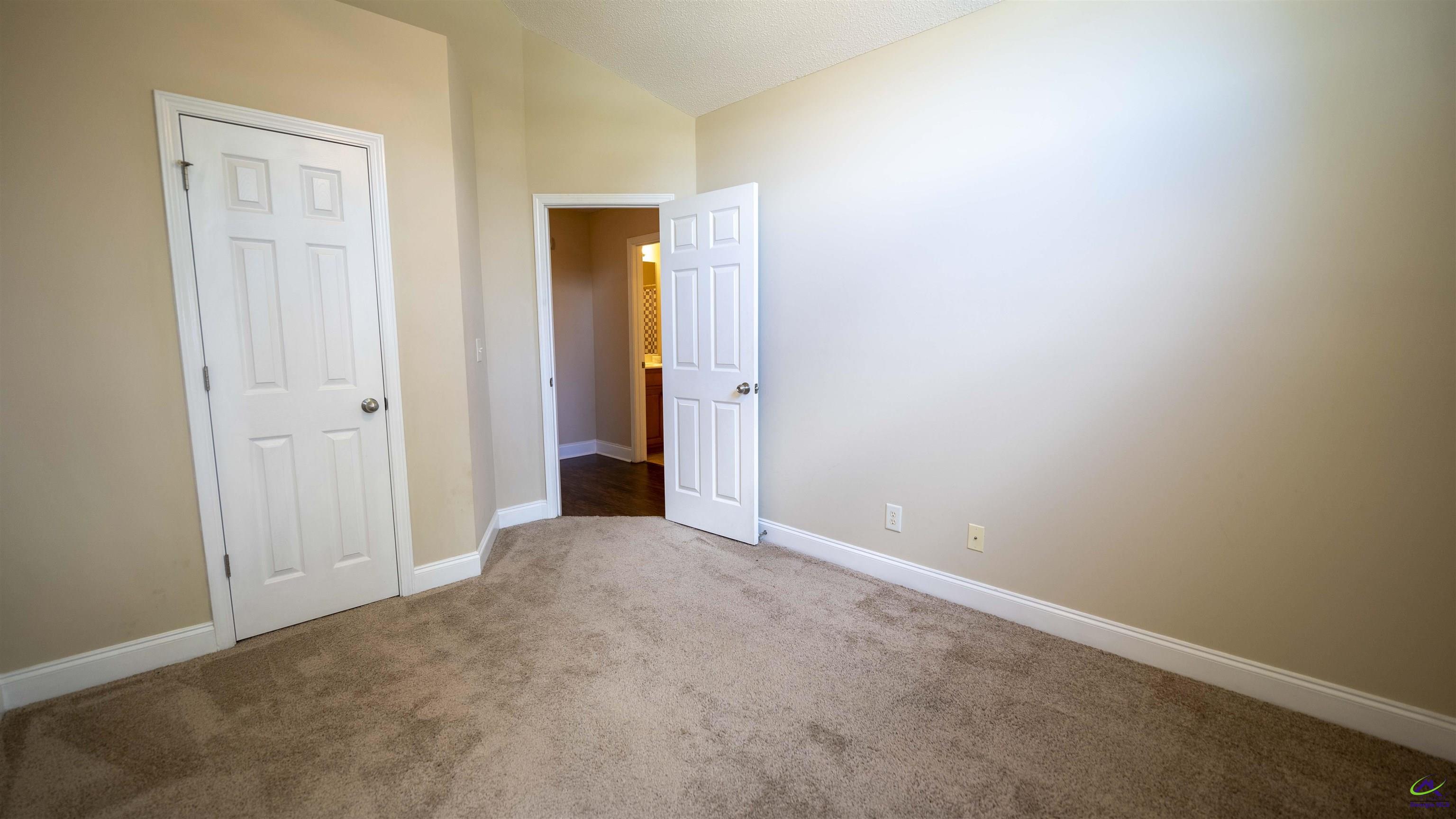 311 Sugarloaf Parkway Perry, GA 31069 - Photo 25 of 31 an empty room with closet area