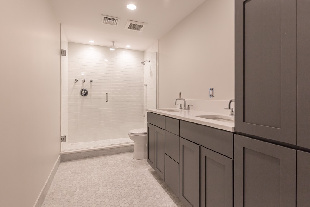 290 North Street, Unit 2 Boston, MA 02113 - Photo 3 of 8 a bathroom with a double vanity sink toilet and shower