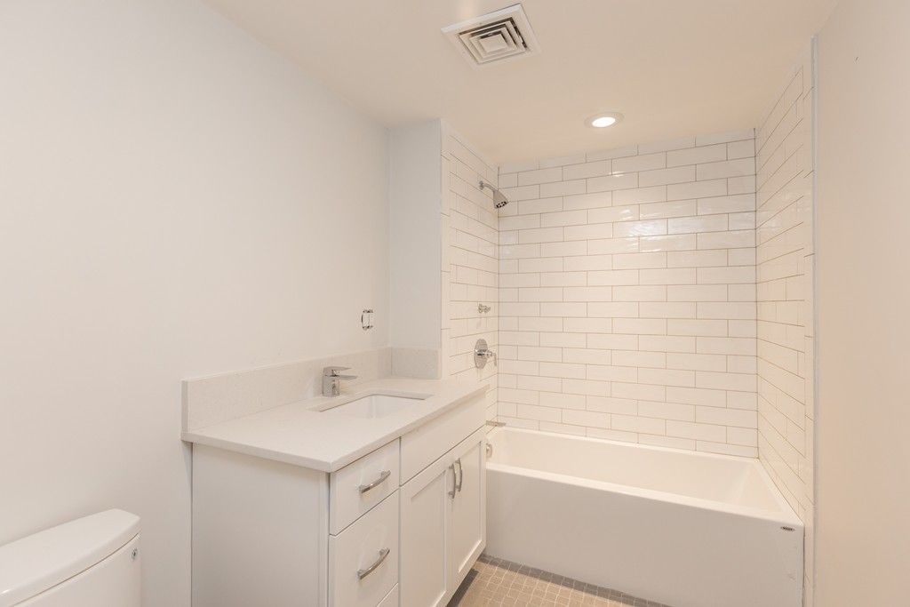 290 North Street, Unit 2 Boston, MA 02113 - Photo 6 of 8 a bathroom with a sink a toilet and shower