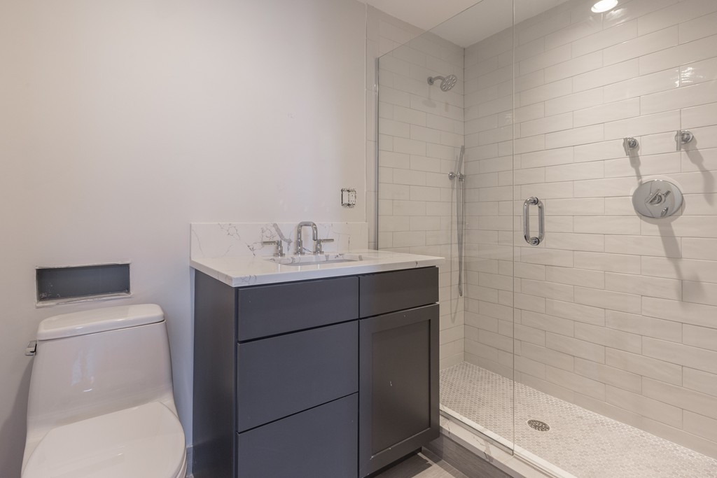 290 North Street, Unit 2 Boston, MA 02113 - Photo 8 of 8 a bathroom with a sink toilet and shower