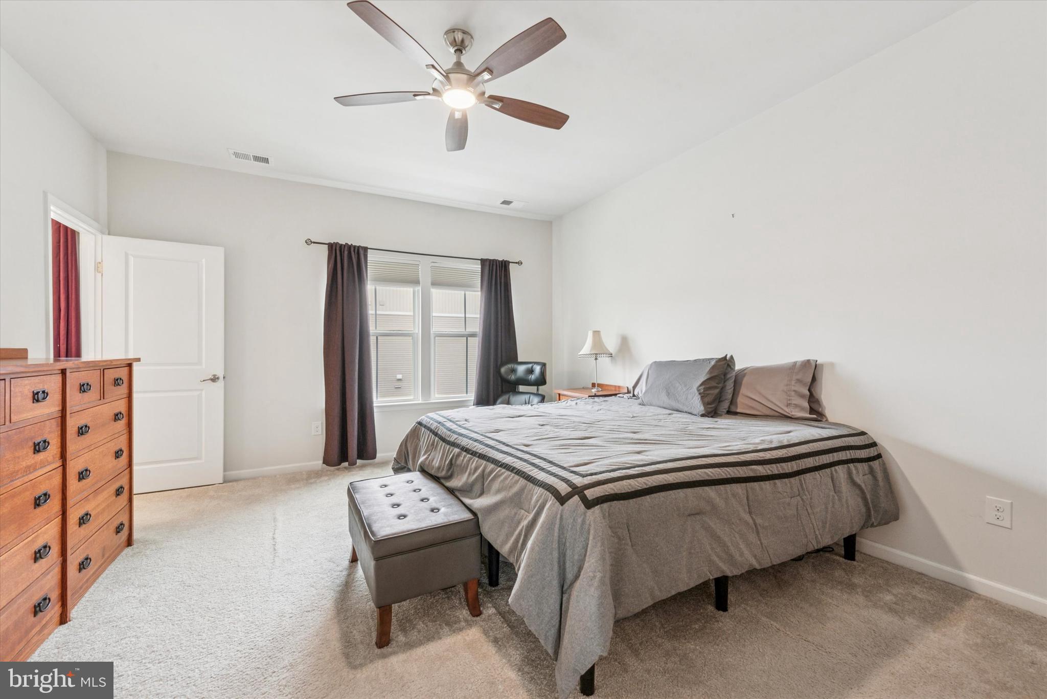 515 Quarry Point Road Malvern, PA 19355 - Photo 14 of 25 a bedroom with a bed and a chandelier