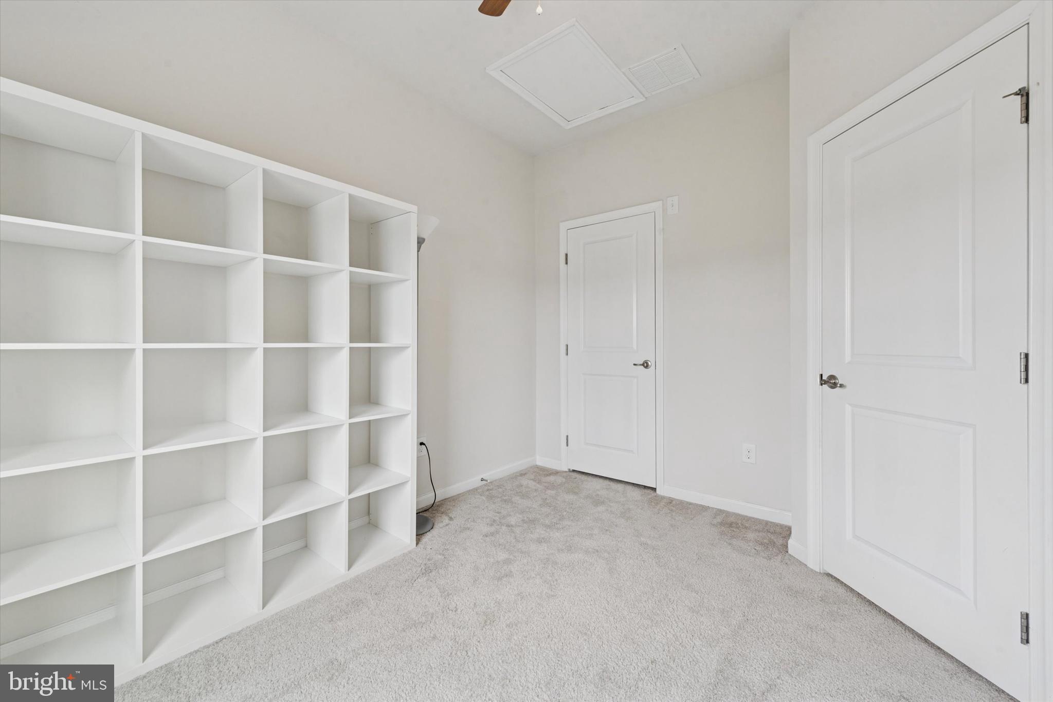 515 Quarry Point Road Malvern, PA 19355 - Photo 22 of 25 a view of an empty room with empty shelves