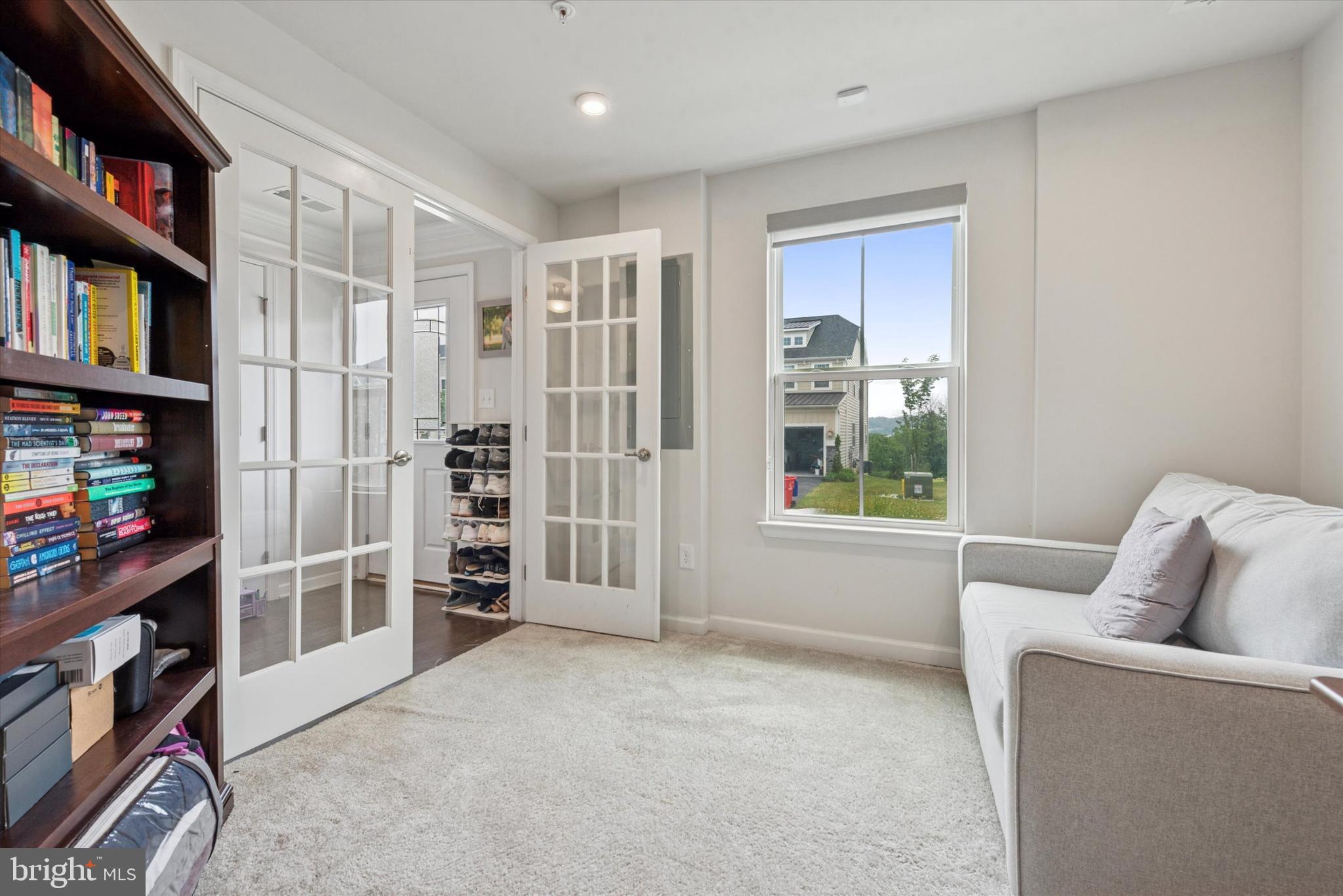 515 Quarry Point Road Malvern, PA 19355 - Photo 4 of 25 a living room with furniture and a book shelf