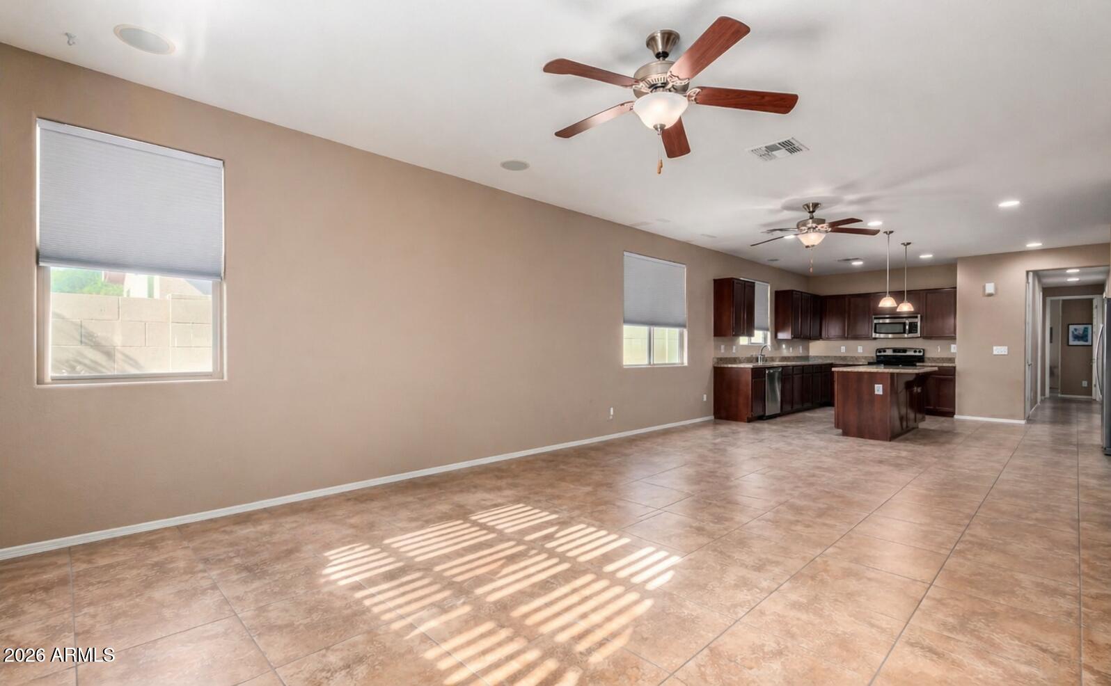 16093 West Almeria Road Goodyear, AZ 85395 - Photo 2 of 38 Family room/kitchen m/kitchen