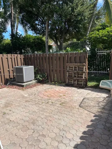 a view of outdoor space with wooden fence