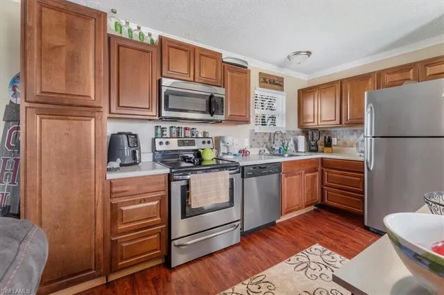 a view of a house with swimming pool and sitting area