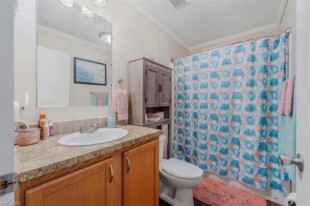 a view of a walk in closet and bathroom