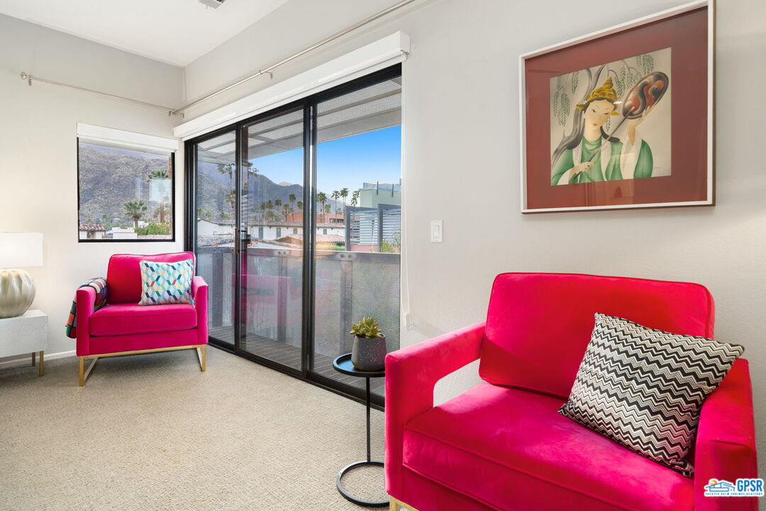665 East Arenas Road Palm Springs, CA 92262 - Photo 24 of 40 a living room with furniture and a rug