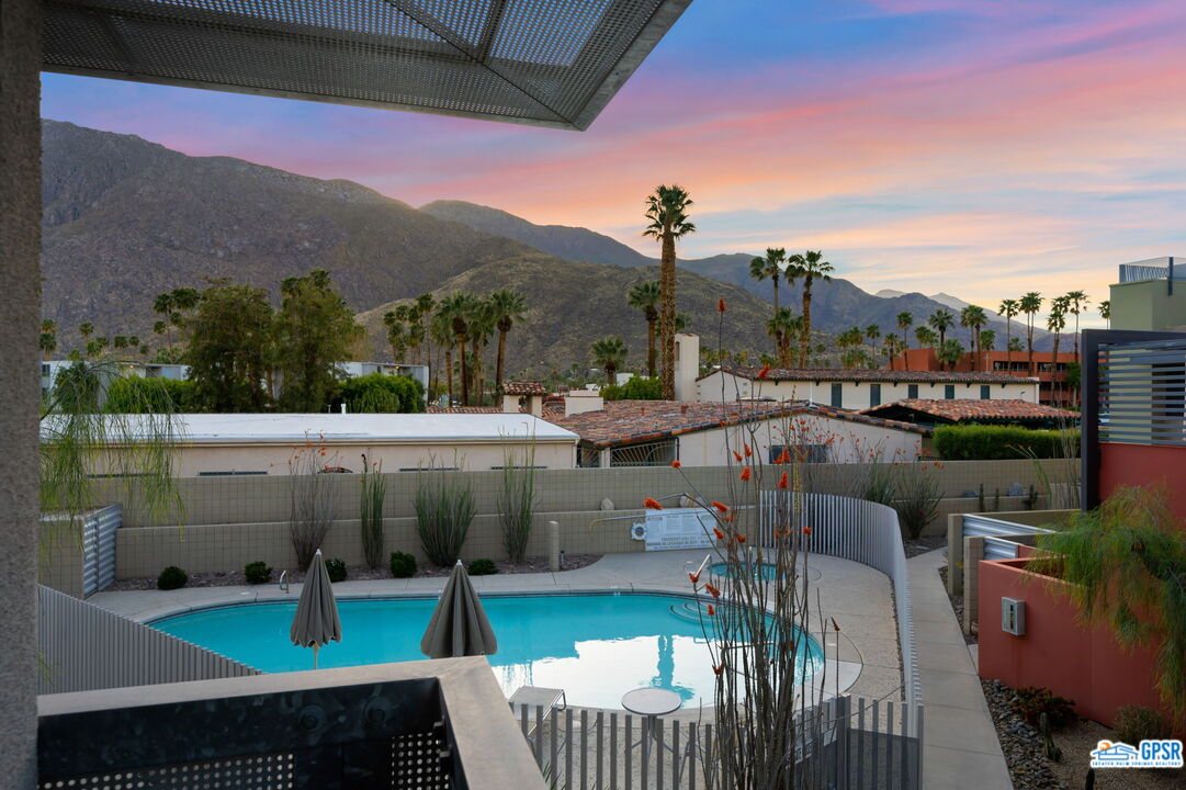 665 East Arenas Road Palm Springs, CA 92262 - Photo 28 of 40 a view of swimming pool outdoor seating and city view