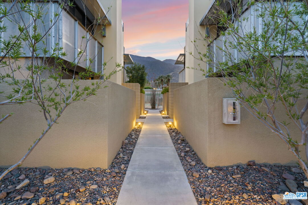 665 East Arenas Road Palm Springs, CA 92262 - Photo 3 of 40 a view of a pathway with a yard