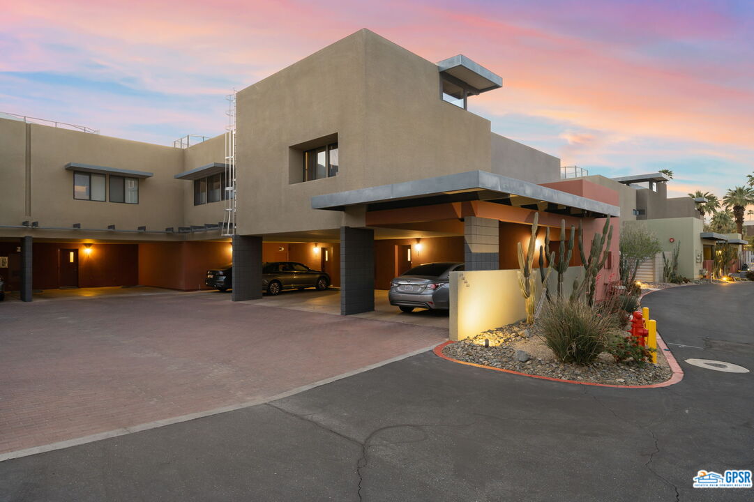 665 East Arenas Road Palm Springs, CA 92262 - Photo 36 of 40 a view of a house with a yard and sitting space