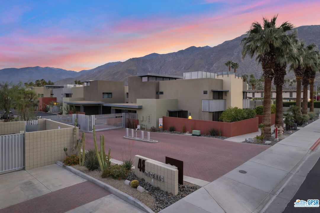 665 East Arenas Road Palm Springs, CA 92262 - Photo 37 of 40 a view of a terrace with a garden