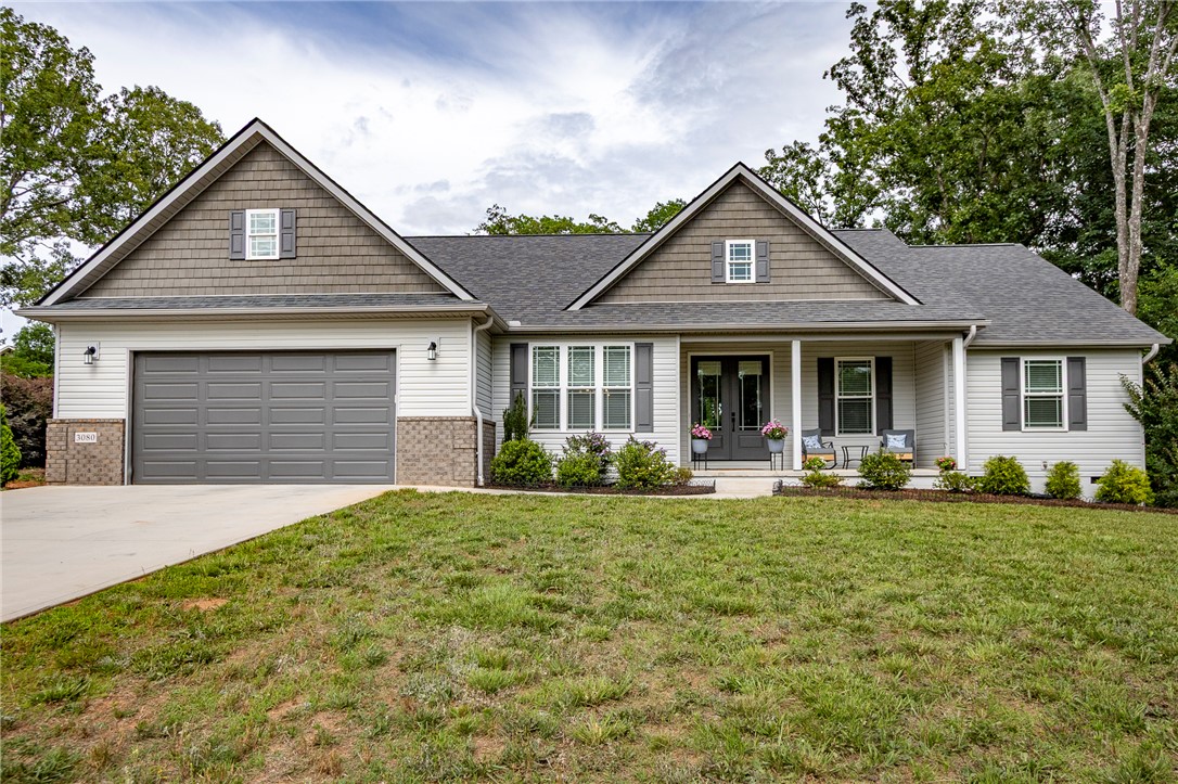3080 McGee Road Iva, SC 29655 - Photo 2 of 49 A welcoming front porch and attached garage create a lovely approach to this residence.
