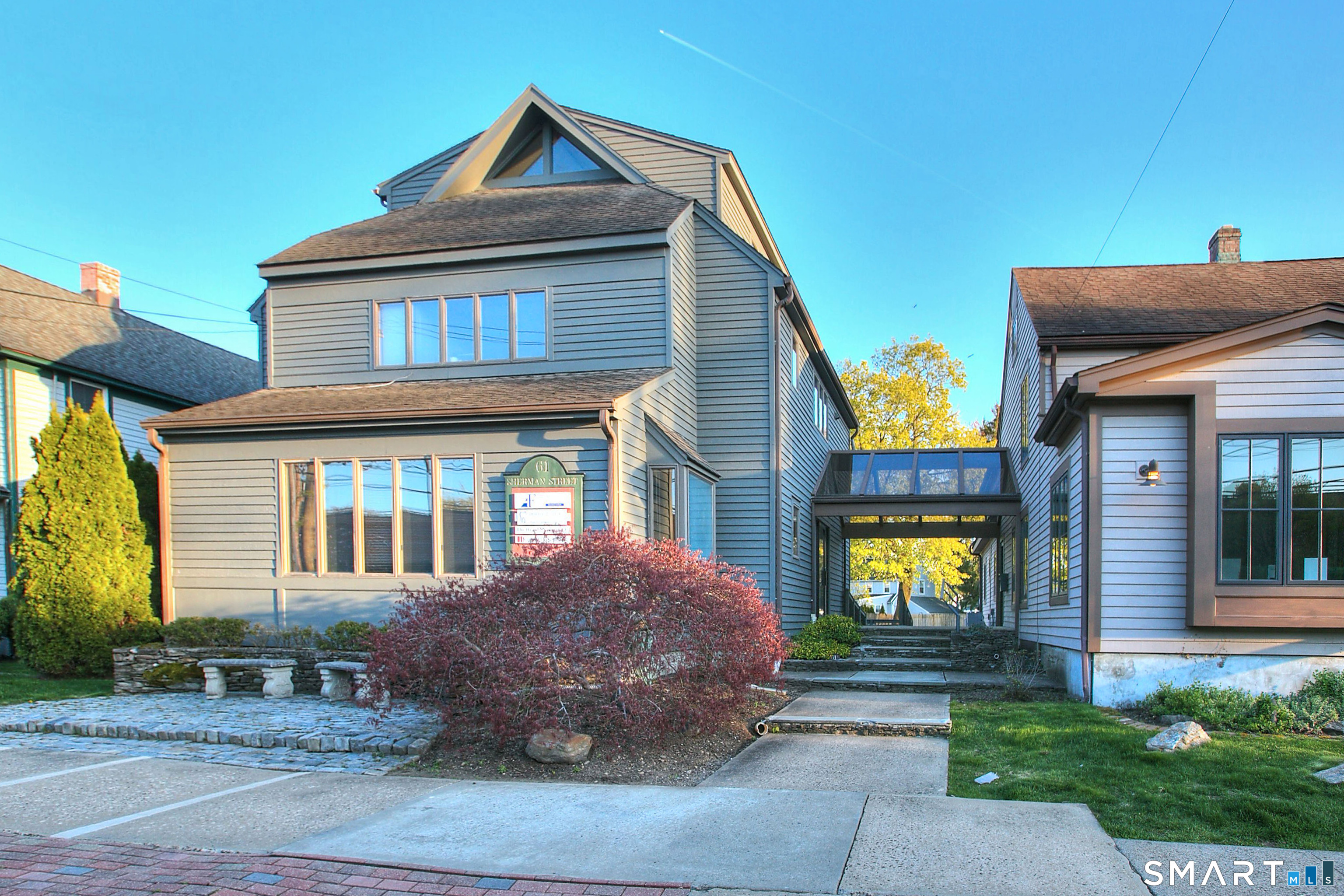 61 Sherman Street Fairfield, CT 06824 - Photo 1 of 1 a front view of a house with a yard