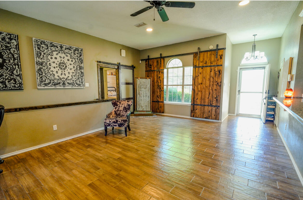 603 15th Street Shallowater, TX 79363 - Photo 2 of 18 a view of a livingroom with furniture window and wooden floor