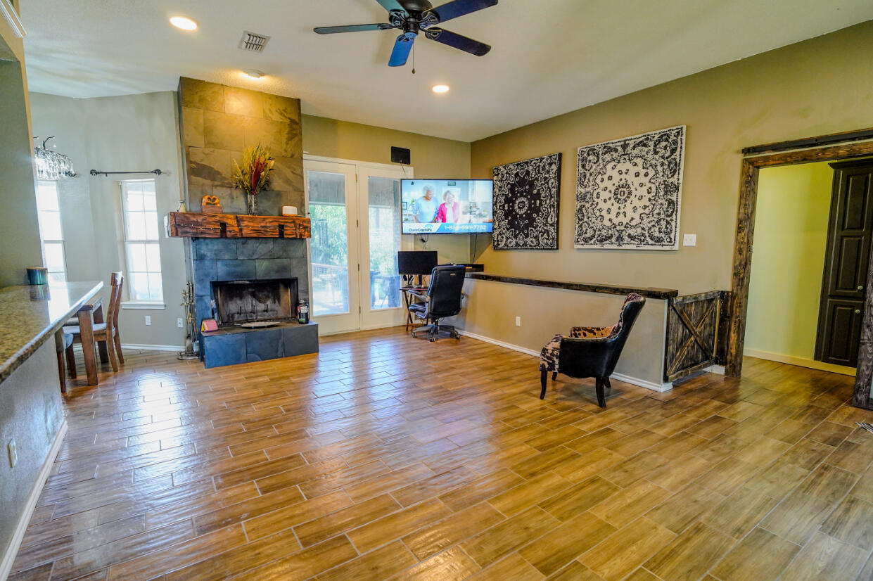 603 15th Street Shallowater, TX 79363 - Photo 3 of 18 a living room with furniture and a fireplace
