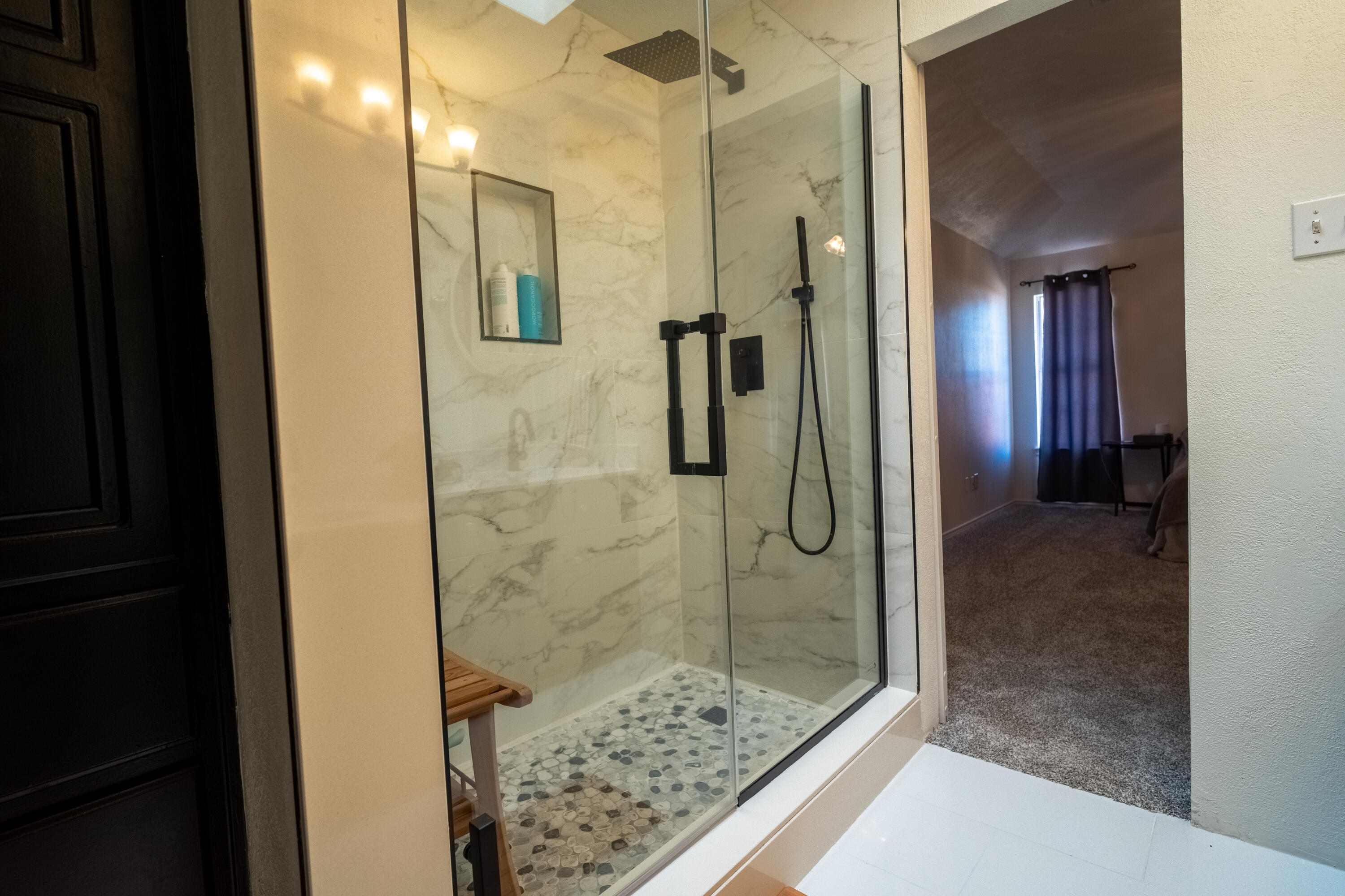 603 15th Street Shallowater, TX 79363 - Photo 8 of 18 a bathroom with a shower