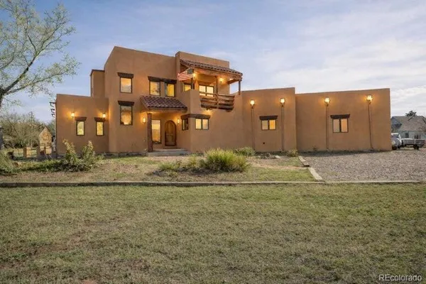 a front view of house with yard