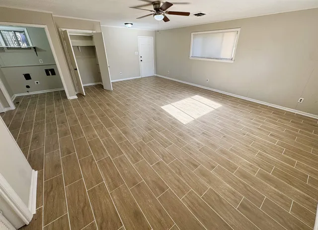a view of an empty room with a sink