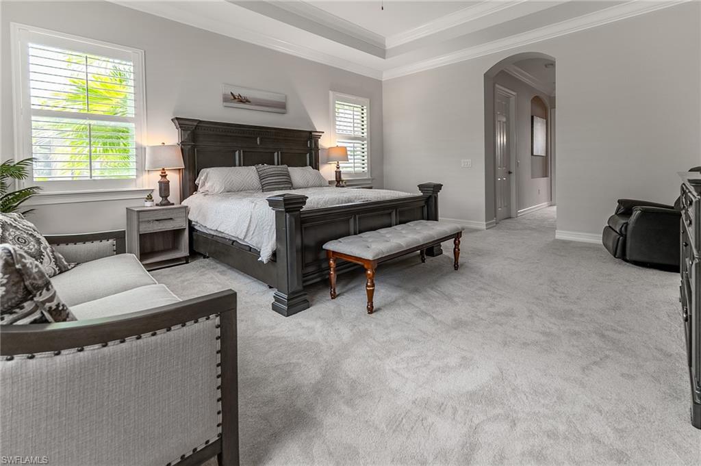 1387 Mockingbird Drive Naples, FL 34120 - Photo 22 of 46 a bedroom with furniture and a window