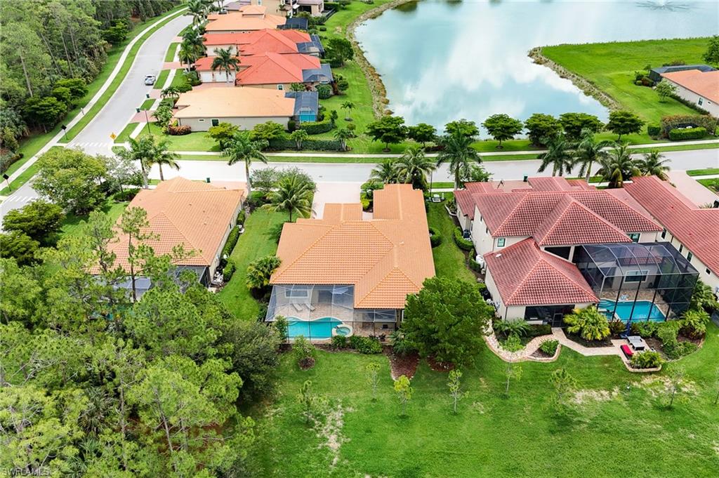 1387 Mockingbird Drive Naples, FL 34120 - Photo 44 of 46 an aerial view of house with yard and lake view