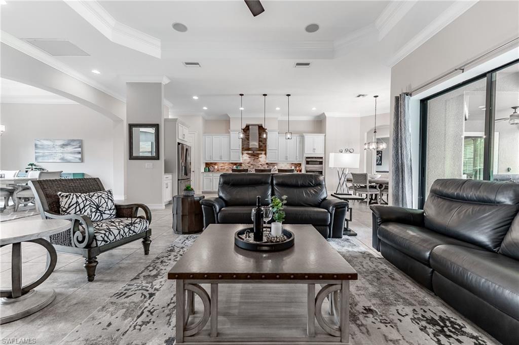 1387 Mockingbird Drive Naples, FL 34120 - Photo 8 of 46 a view of a dining room with furniture