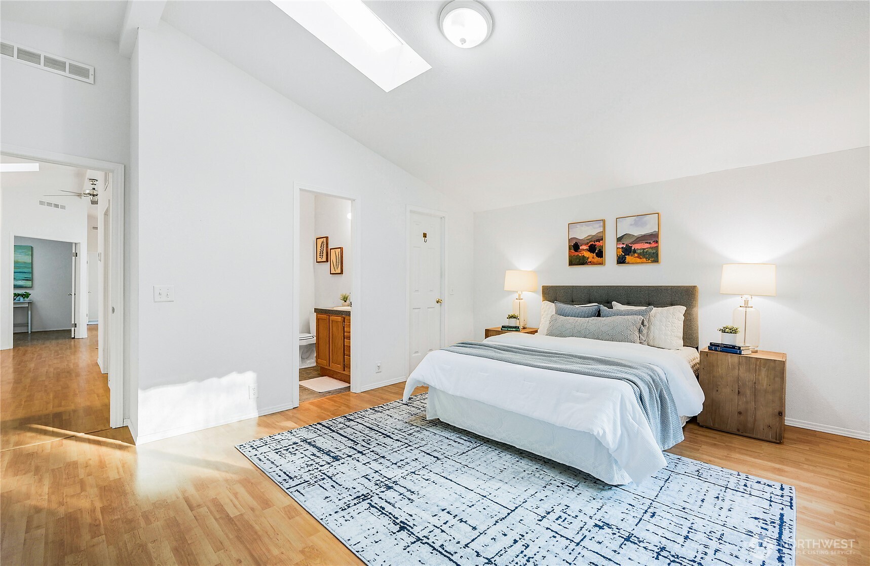 2399 Highland Loop Port Townsend, WA 98368 - Photo 12 of 31 a bedroom with a bed and wooden floor