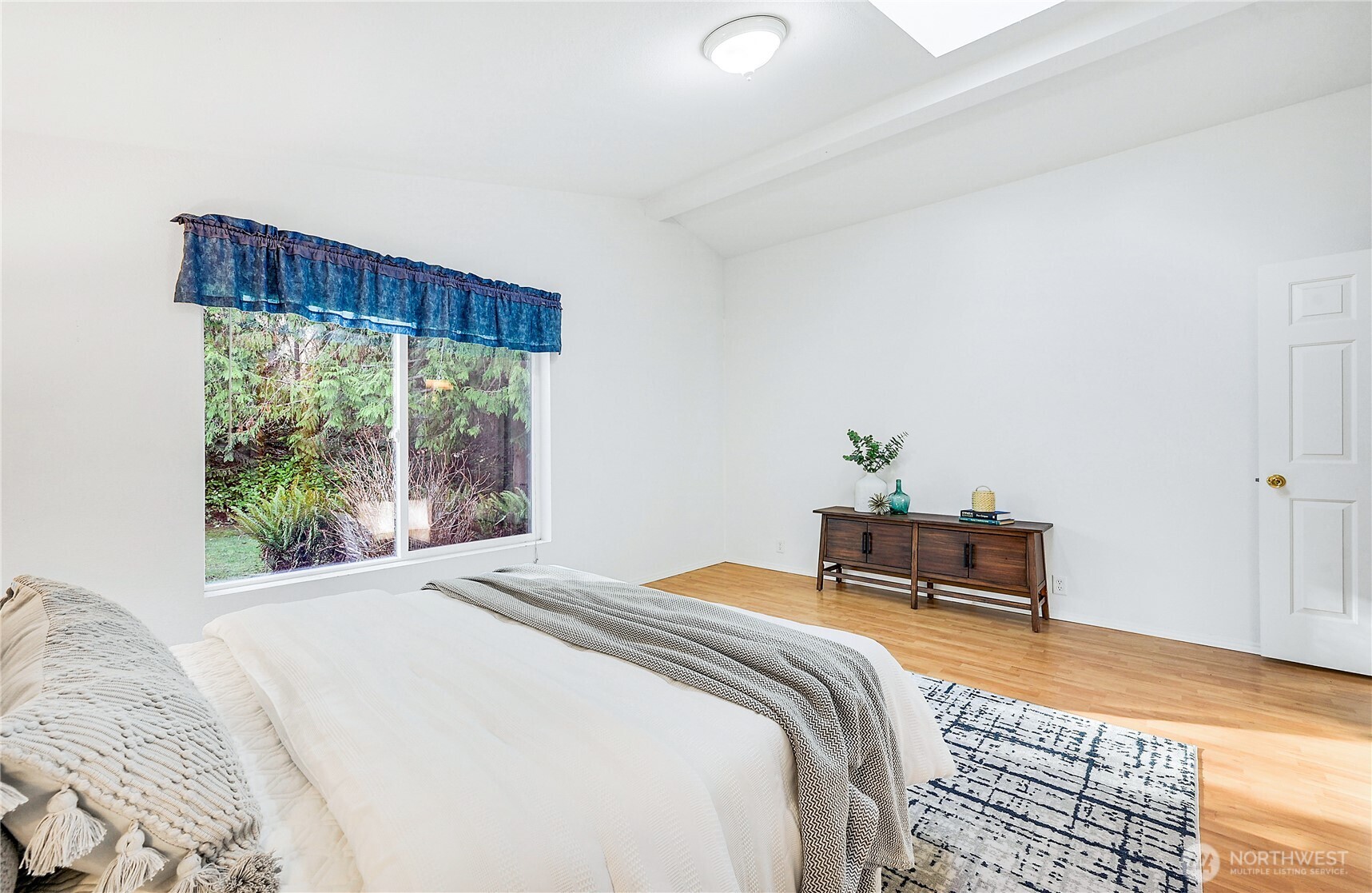 2399 Highland Loop Port Townsend, WA 98368 - Photo 16 of 31 a bedroom with a bed table and a window