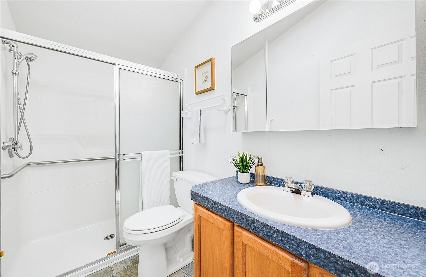 2399 Highland Loop Port Townsend, WA 98368 - Photo 23 of 31 a bathroom with a granite countertop sink toilet and shower