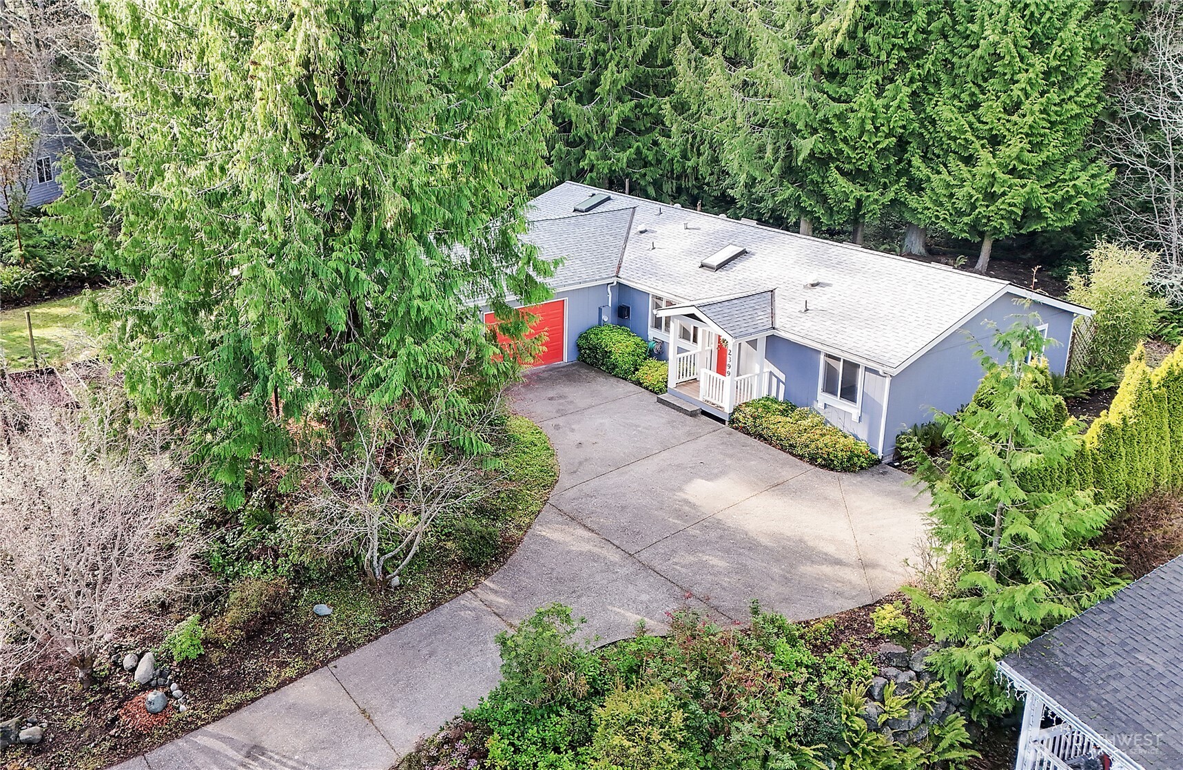 2399 Highland Loop Port Townsend, WA 98368 - Photo 31 of 31 an aerial view of a house with a yard and large trees