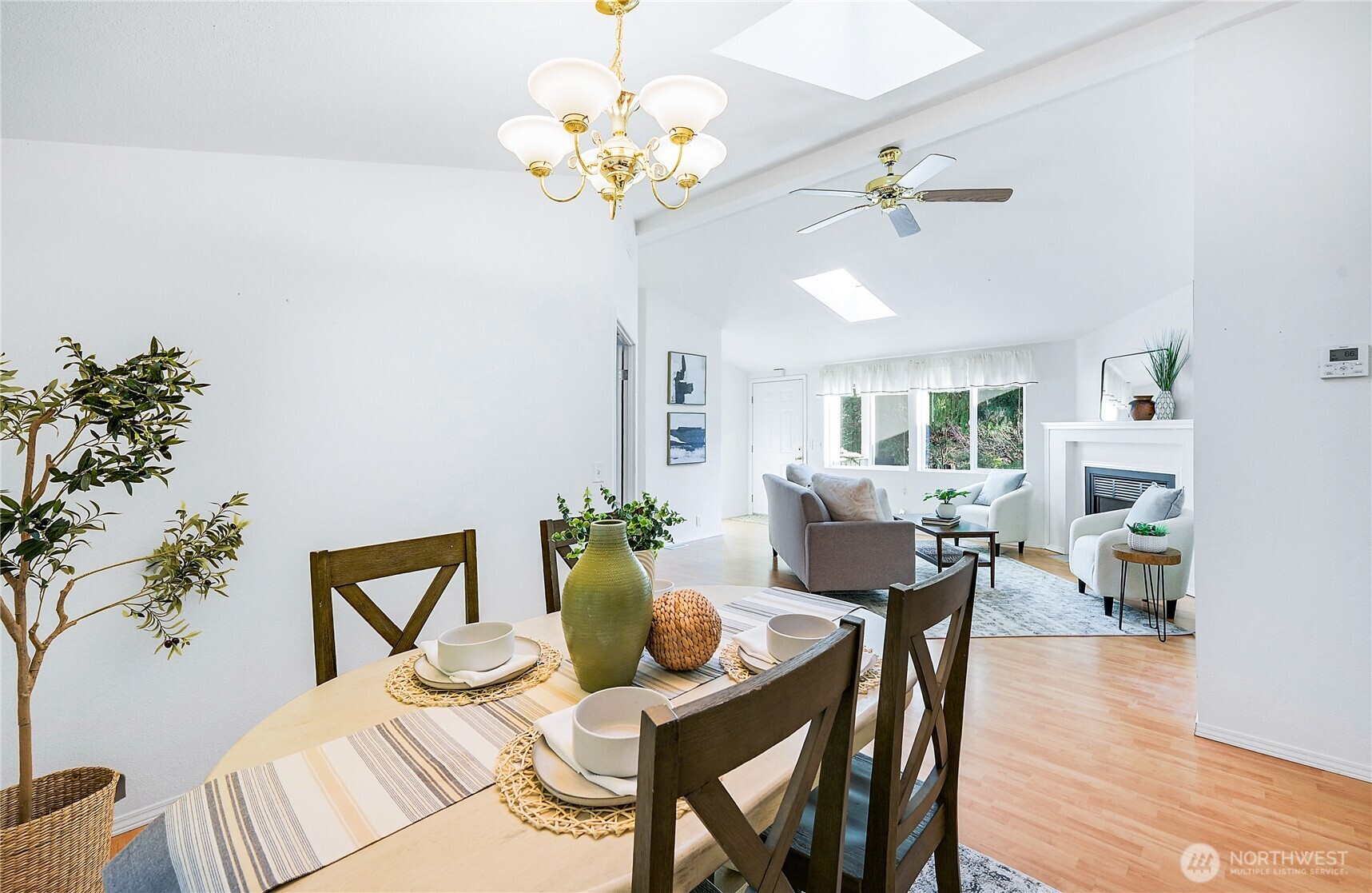 2399 Highland Loop Port Townsend, WA 98368 - Photo 4 of 31 a view of a dining room with furniture a chandelier and wooden floor