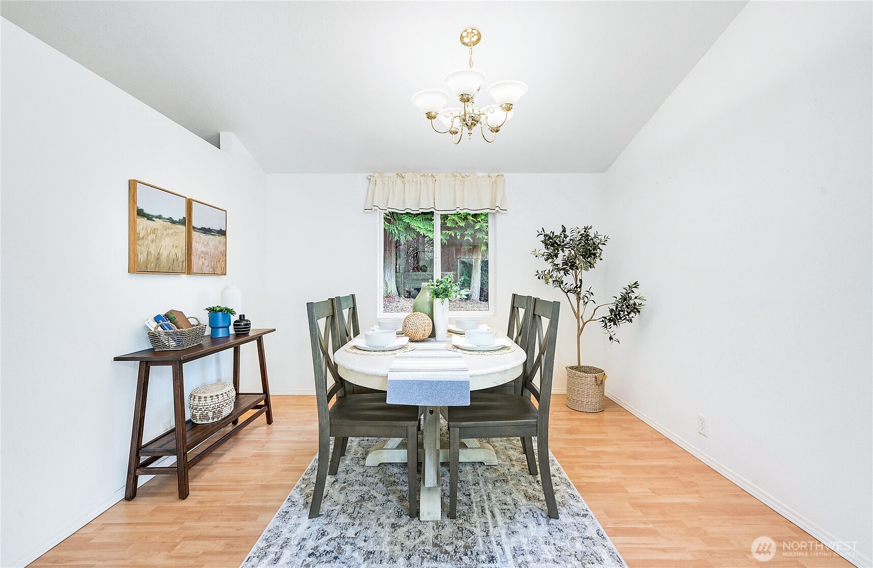 2399 Highland Loop Port Townsend, WA 98368 - Photo 5 of 31 a dining room with furniture a rug and a chandelier