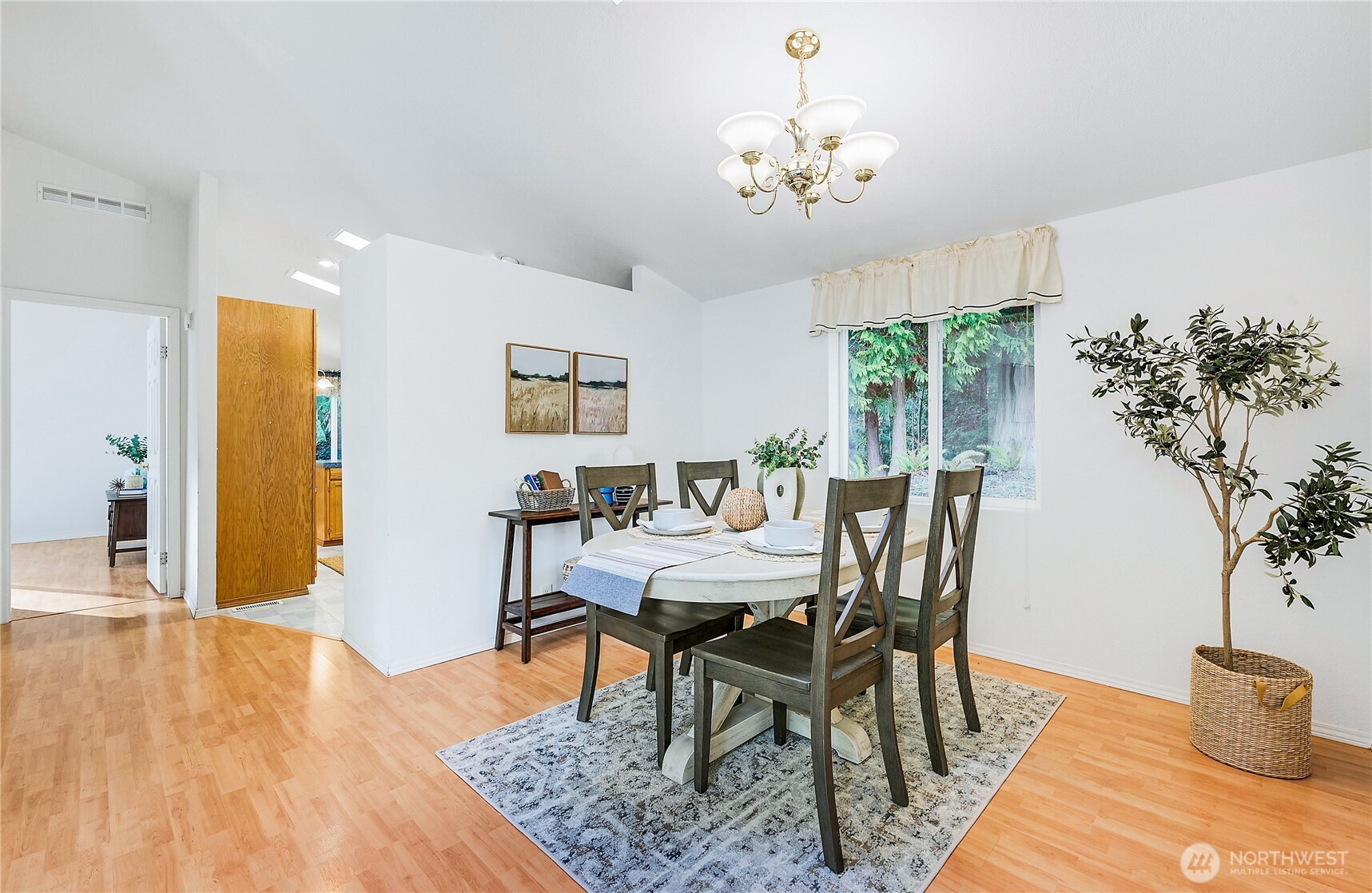 2399 Highland Loop Port Townsend, WA 98368 - Photo 6 of 31 a view of a dining room with furniture and wooden floor