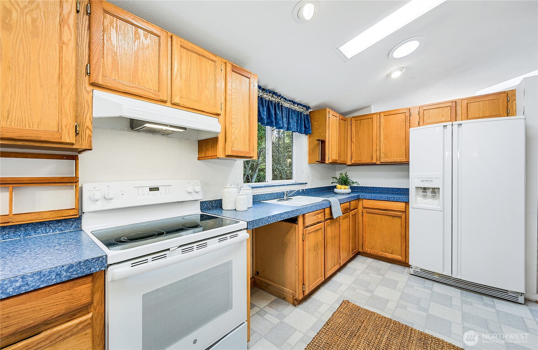 2399 Highland Loop Port Townsend, WA 98368 - Photo 8 of 31 a kitchen with stainless steel appliances granite countertop a sink a stove and refrigerator