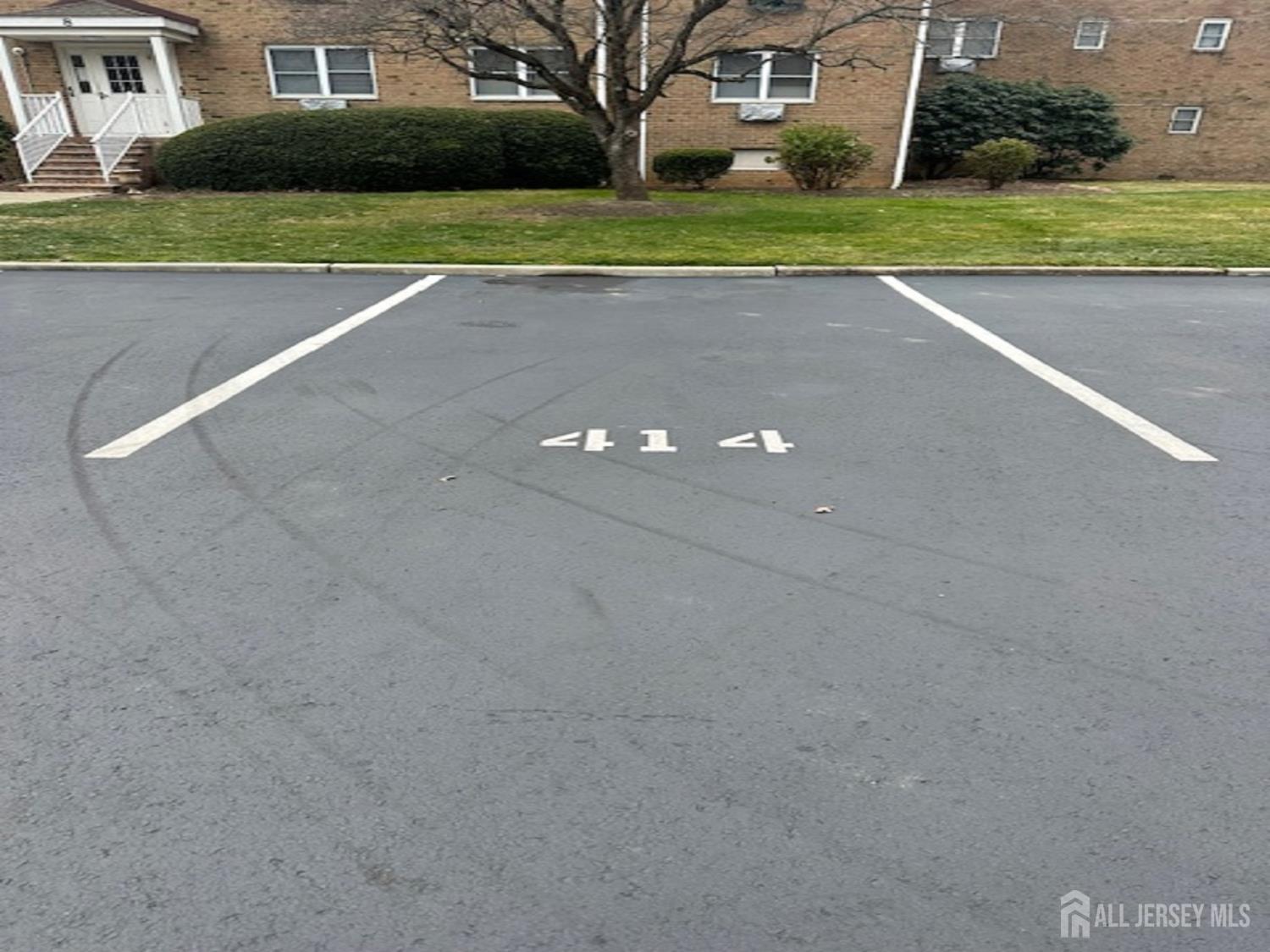 8 Manchester Court, Unit F Freehold, NJ 07728 - Photo 12 of 13 a view of a house with a big yard