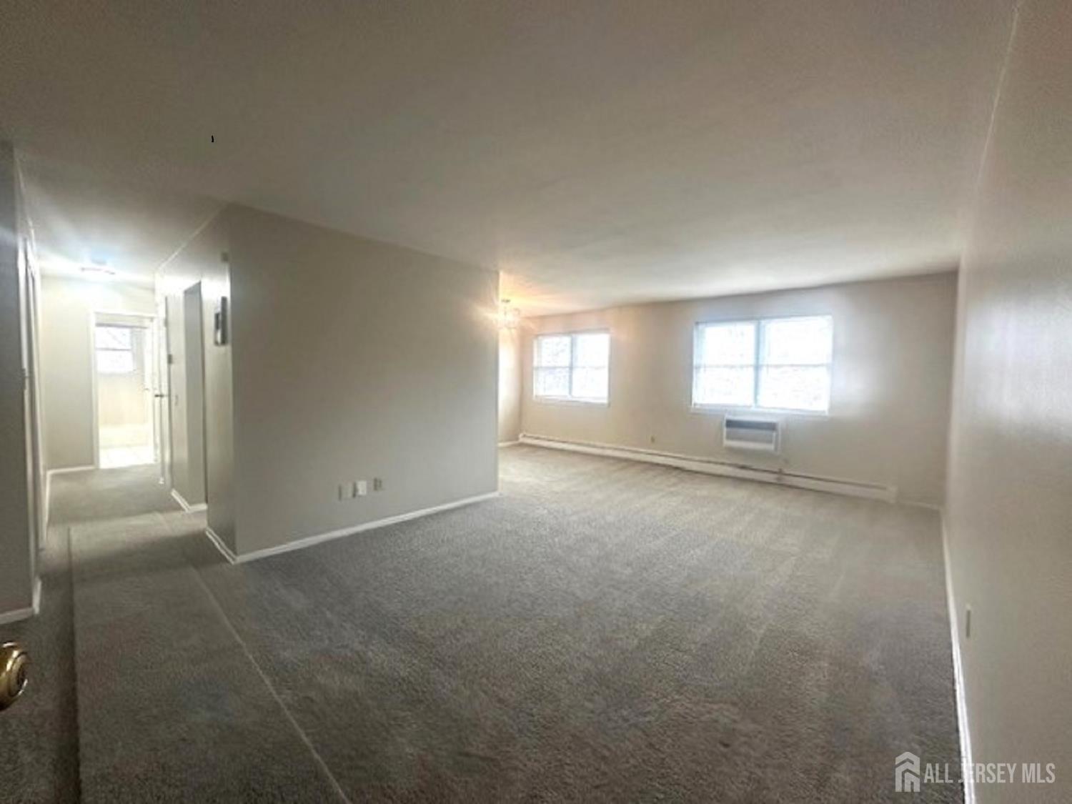 8 Manchester Court, Unit F Freehold, NJ 07728 - Photo 2 of 13 a view of empty room with window