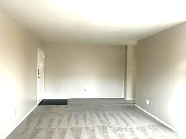 an empty room with a bench