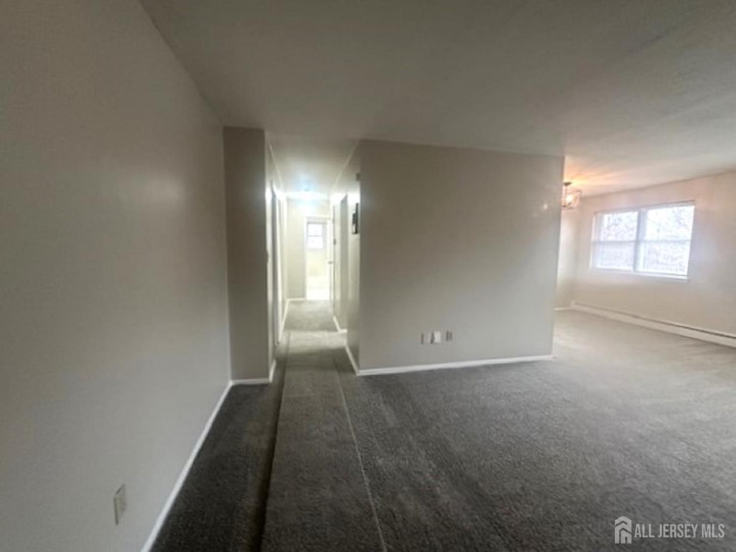 8 Manchester Court, Unit F Freehold, NJ 07728 - Photo 6 of 13 a view of empty room with window