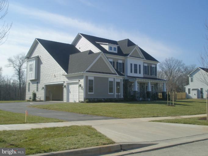 20218 McNamara Road Poolesville, MD 20837 - Photo 1 of 2 a view of a big house with a big yard and large trees