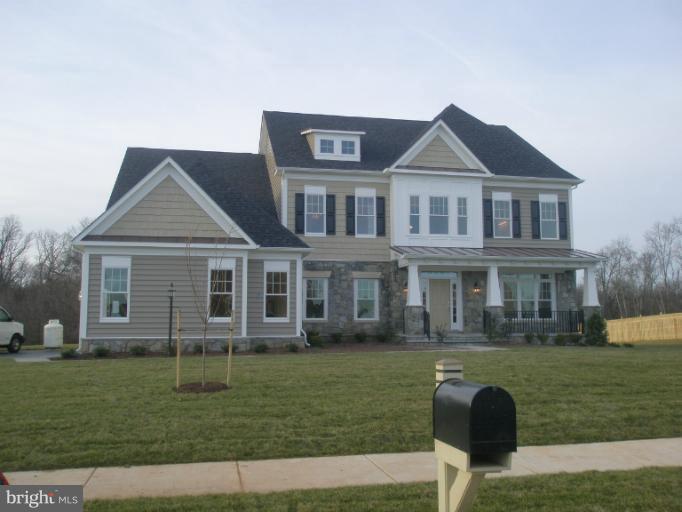 20218 McNamara Road Poolesville, MD 20837 - Photo 2 of 2 a front view of a house with a garden