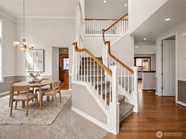 a view of entryway and hall with wooden floor